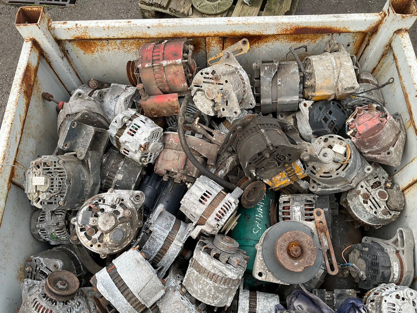 Crate of Used Charging Alternators