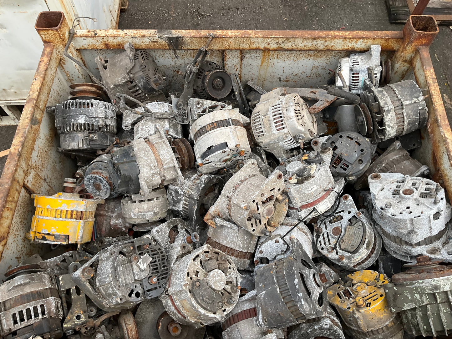 Crate of Used Charging Alternators